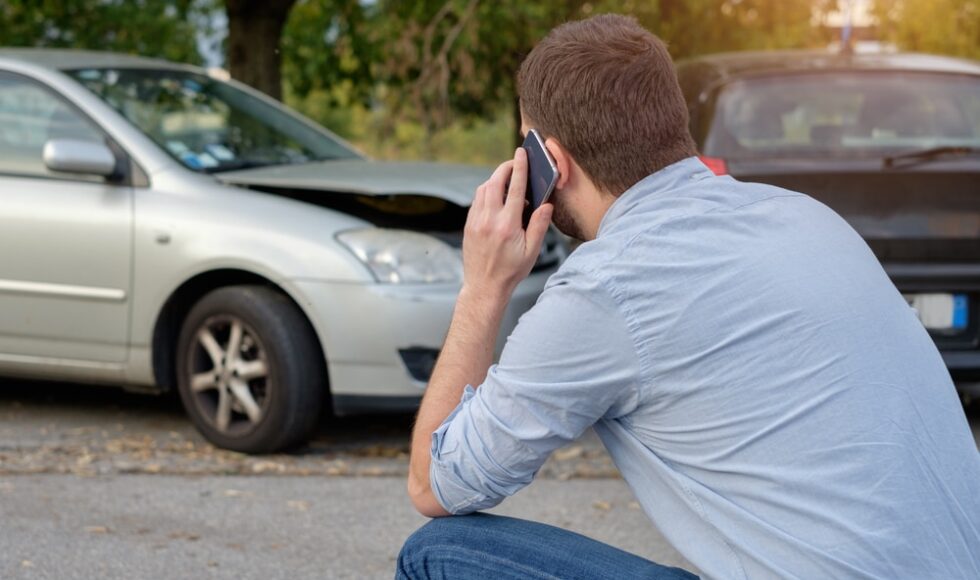 a car accident victim on the phone with his attorney