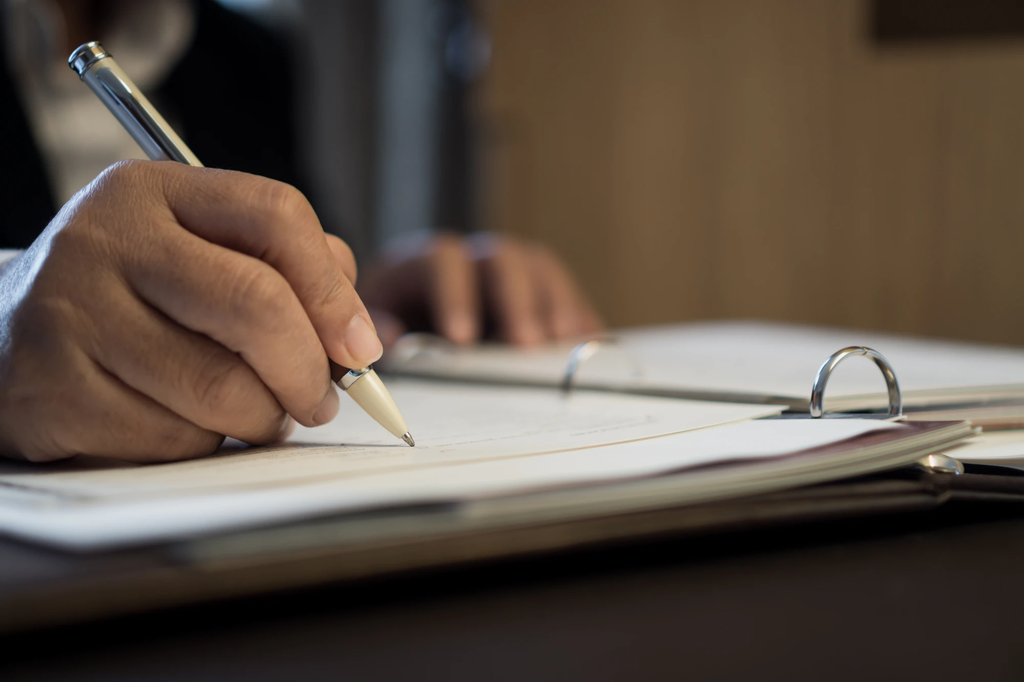 Lawyer taking notes in a binder