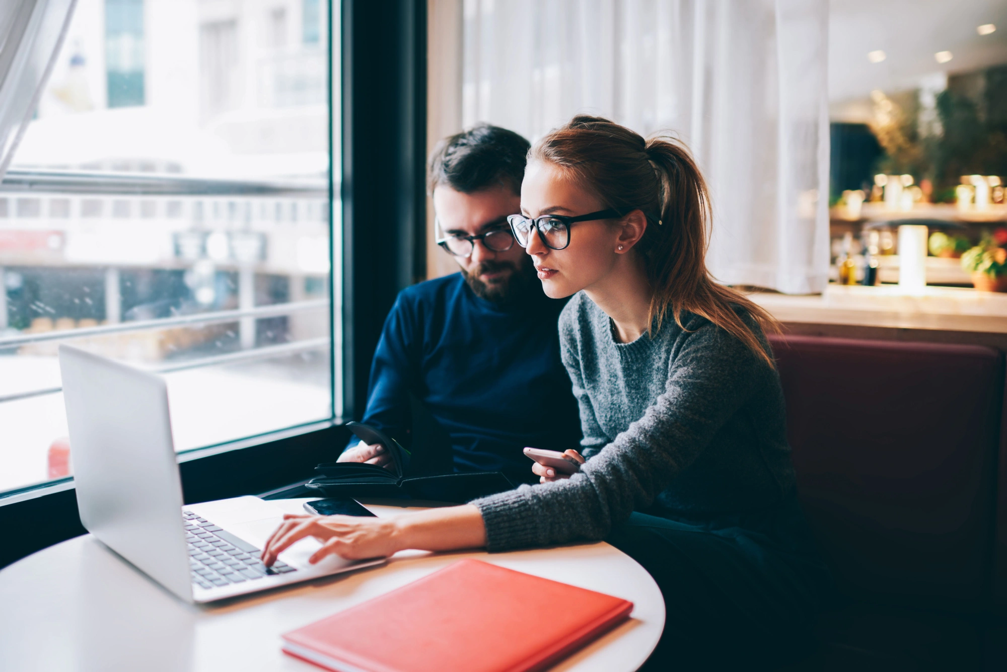 woman working with the best personal injury attorney in houston at a coffee shop