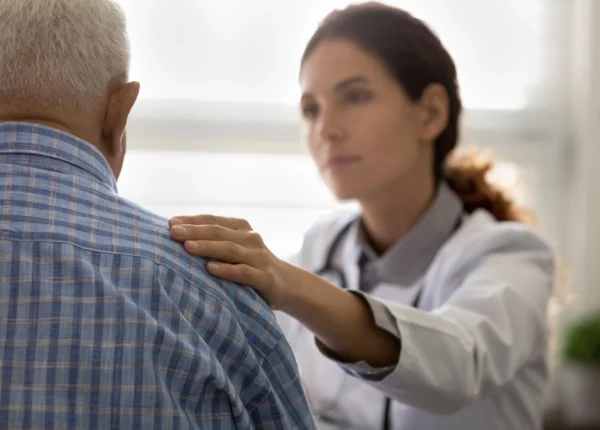 A doctor giving a retired marines a parkinsons diagnosis after drinking water at camp lejeune