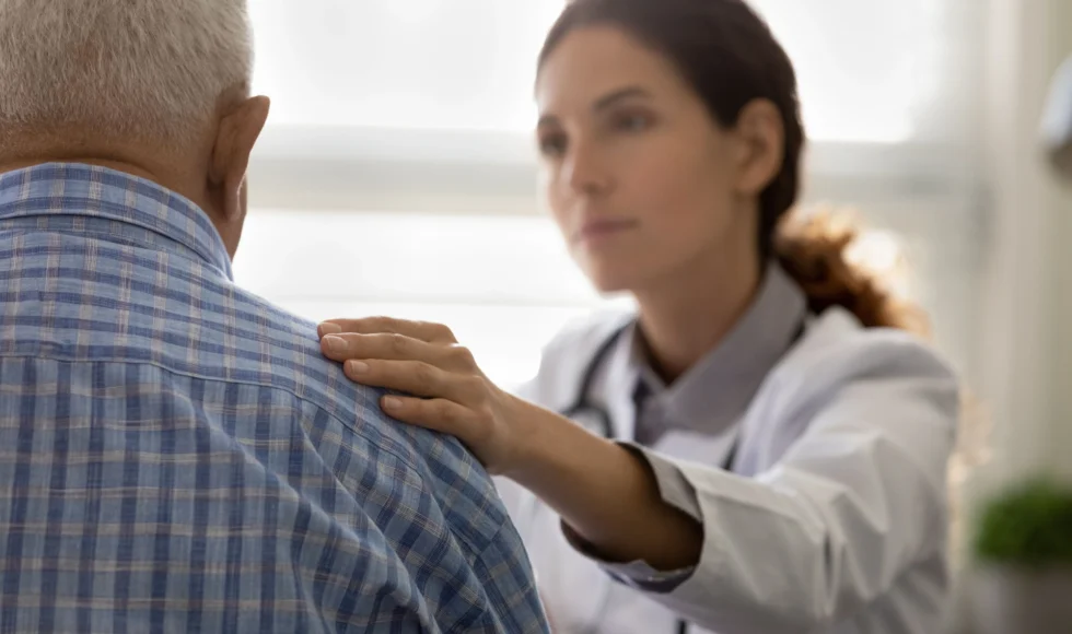 A doctor giving a retired marines a parkinsons diagnosis after drinking water at camp lejeune