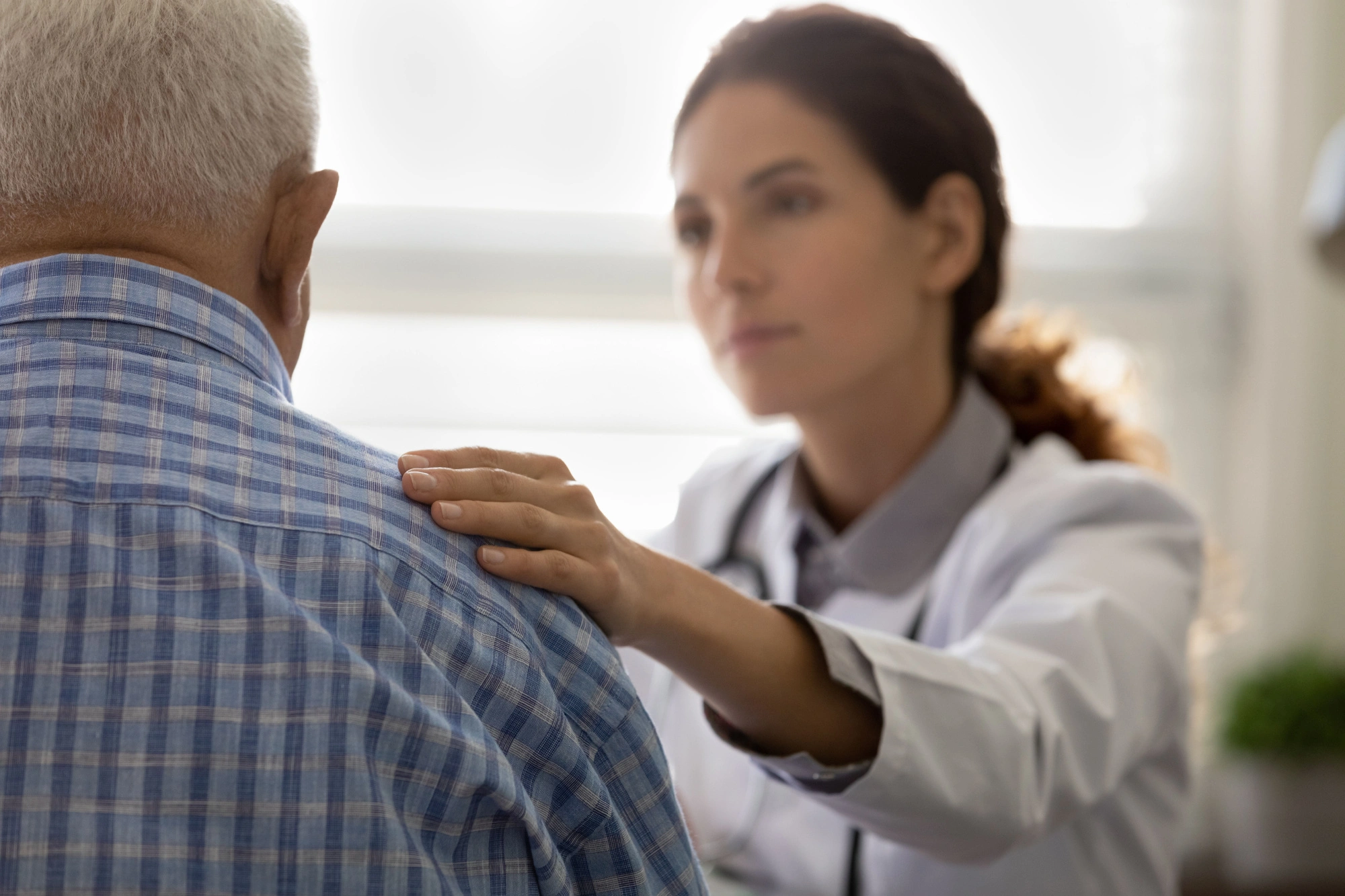 A doctor giving a retired marines a parkinsons diagnosis after drinking water at camp lejeune