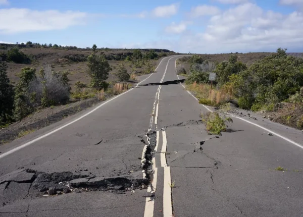 Rural road with huge, dangerous cracks across it