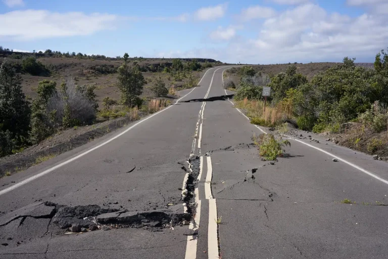 Rural road with huge, dangerous cracks across it