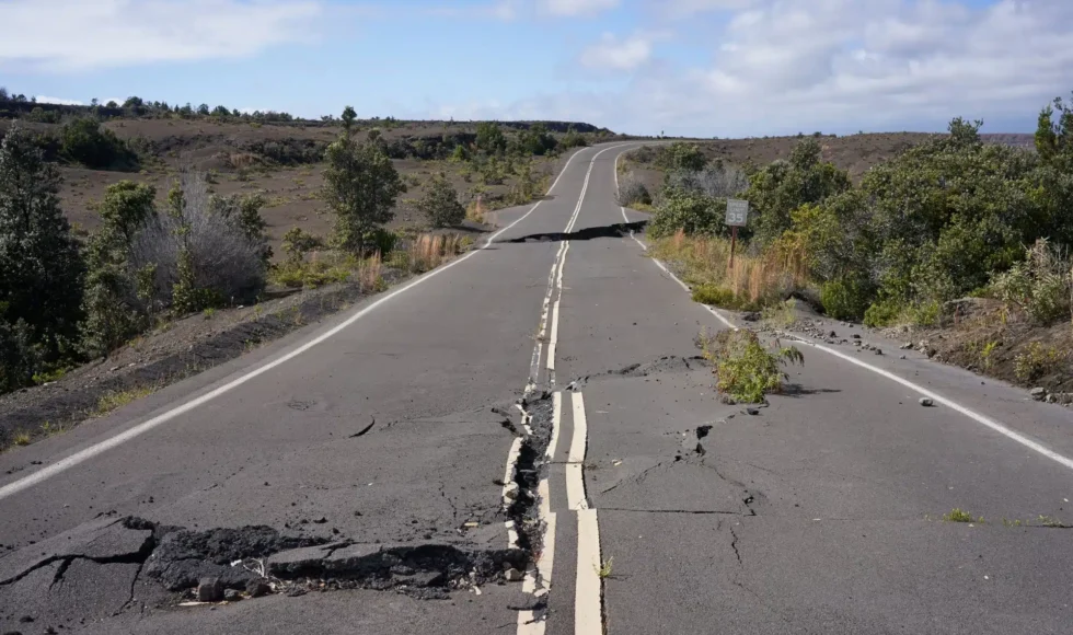 Rural road with huge, dangerous cracks across it